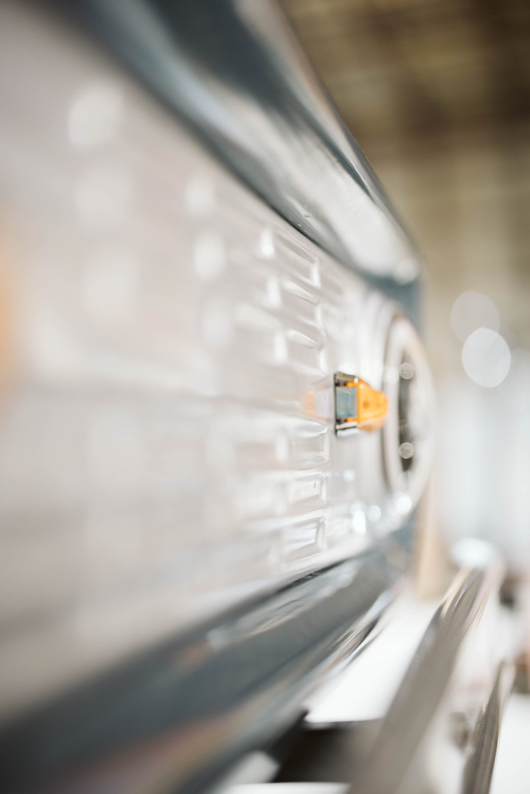 Close-up of body panel seam and indicator light