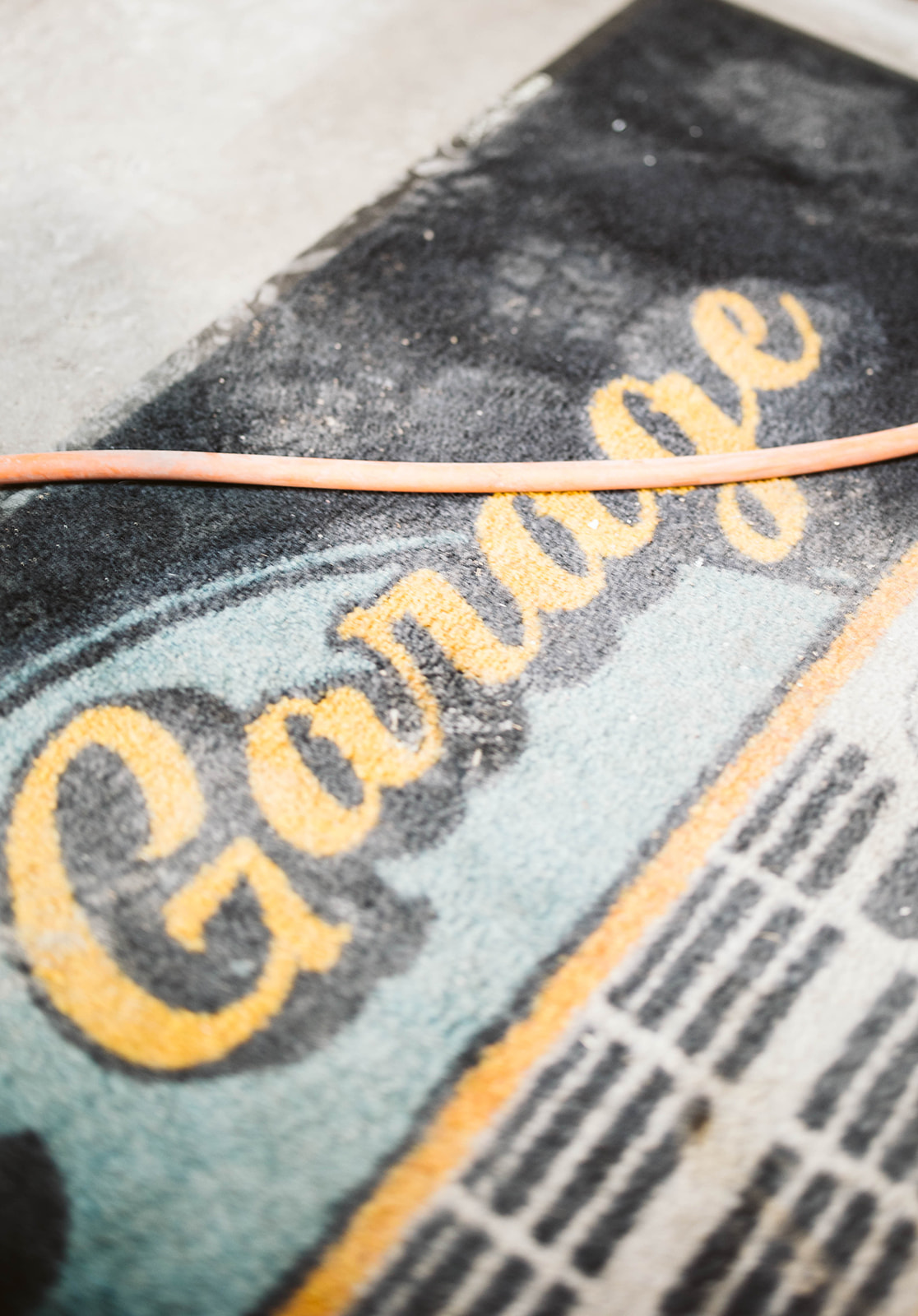 Garage sign detail with orange branding