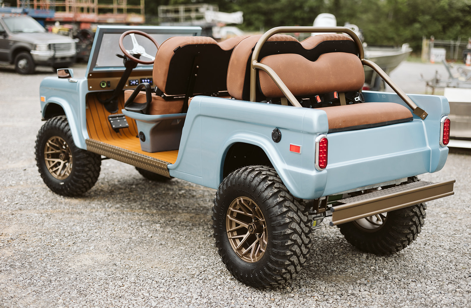 Heritage blue Retro Ride with wood panel detail, rear 3/4 view